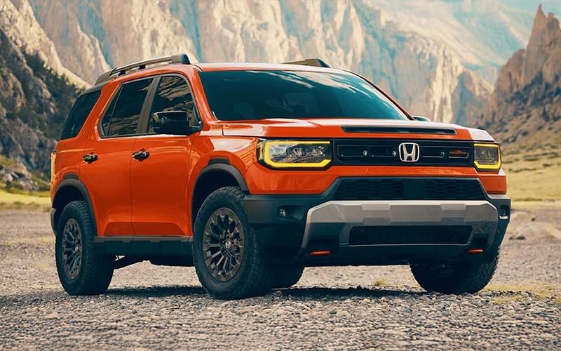2026 Honda Passport SUV in orange with a black hood and front bumper, showcasing a modern and sporty design.