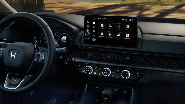 A view of the Honda CR-V's dashboard, focusing on the infotainment screen and climate controls.
