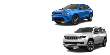 A blue Dodge Hornet and a white Jeep Wagoneer on a white background.